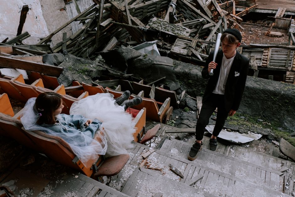 A cinematic shot of a couple embracing during their wedding portrait session